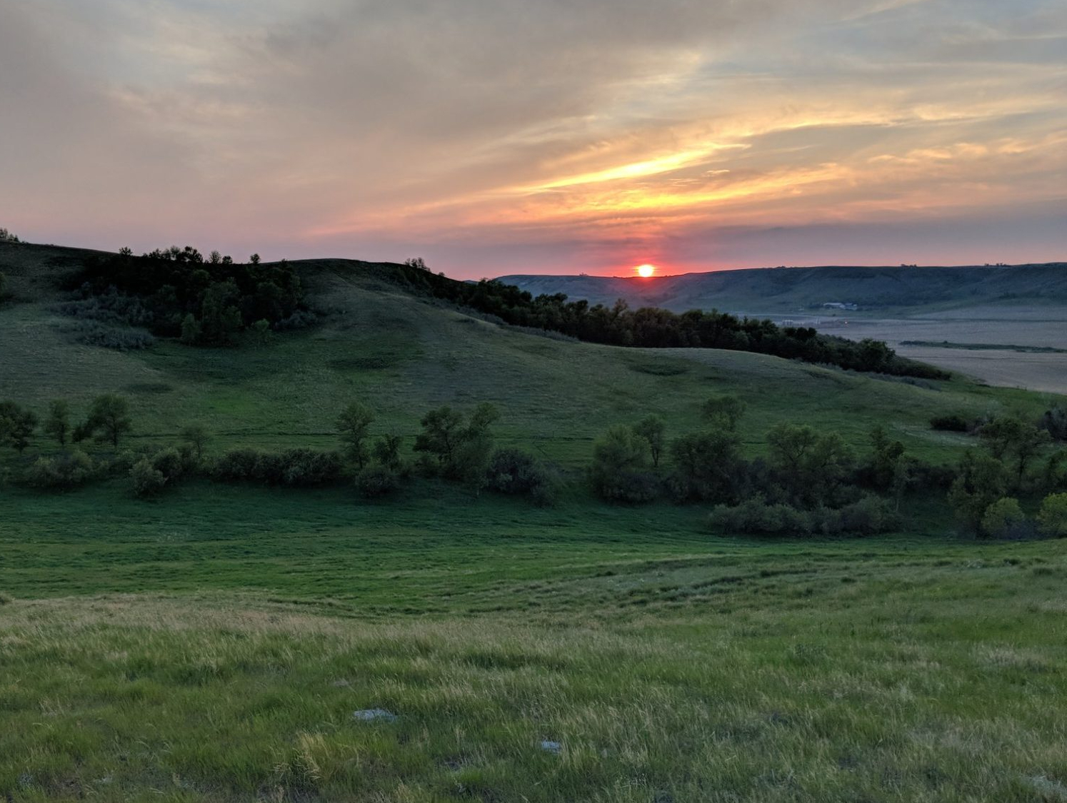 Williston Basin oil field at dusk